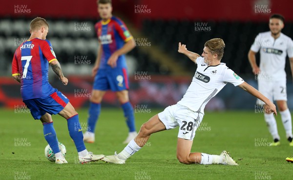 280818 - Swansea City v Crystal Palace - Carabao Cup - George Byers of Swansea City is tackled by Max Meyer of Crystal Palace