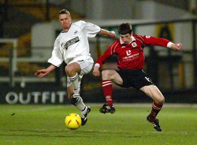 040203 - Swansea City v Darlington - Third Division - Swansea's James Thomas controls the ball under pressure from Neil Wainwright