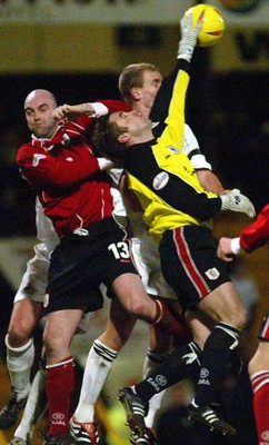 040203 - Swansea City v Darlington - Third Division - Darlington's Keeper Andy Collett and Barry Conlon deny Jason Smith the ball