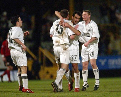 040203 - Swansea City v Darlington - Third Division - Swansea's Roberto Martinez (27) and Michael Howard celebrate with goalscorer Kevin Nugent