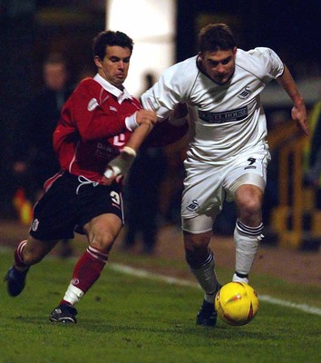 040203 - Swansea City v Darlington - Third Division - Swansea's James Thomas is chased by Simon Betts