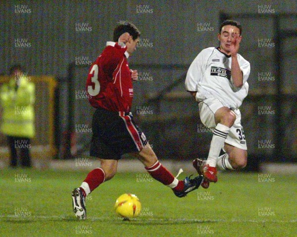 040203 - Swansea City v Darlington - Third Division - Swansea's Leon Britton is tackled by Simon Betts