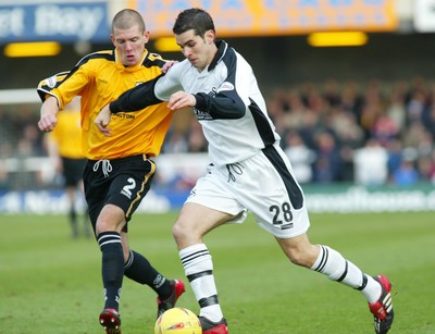 221103 - Swansea City v Darlington - Swansea's Daniel Nardiello is challenged by Ryan Valentine 