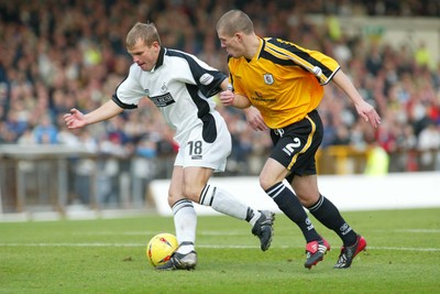 221103 - Swansea City v Darlington - Swansea's Andy Robinson breaks past Ryan Valentine