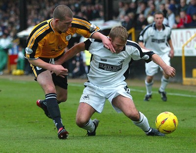 221103 - Swansea City v Darlington - Swansea'sAndy Robinson tangles with Ryan Valentine 