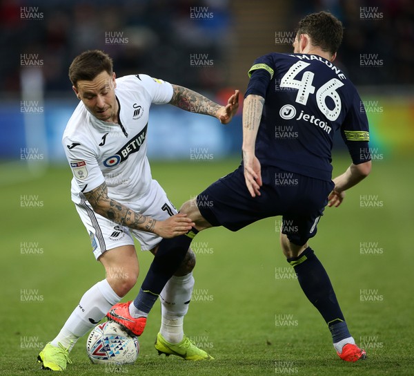 010519 - Swansea City v Derby County - SkyBet Championship - Barrie McKay of Swansea City is tackled by Scott Malone of Derby