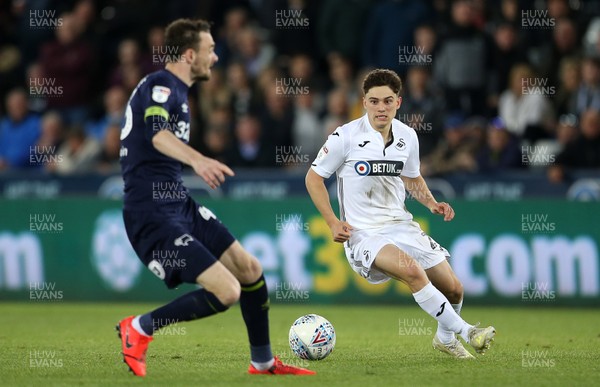 010519 - Swansea City v Derby County - SkyBet Championship - Daniel James of Swansea City is challenged by Scott Malone of Derby