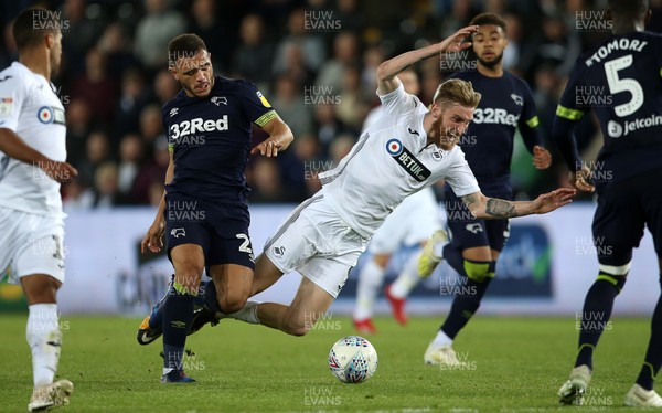 010519 - Swansea City v Derby County - SkyBet Championship - Oli McBurnie of Swansea City is tackled by Mason Bennett of Derby