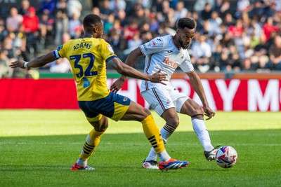 050425 - Swansea City v Derby County - Sky Bet Championship - Cyrus Christie of Swansea City takes on Ebou Adams of Derby County