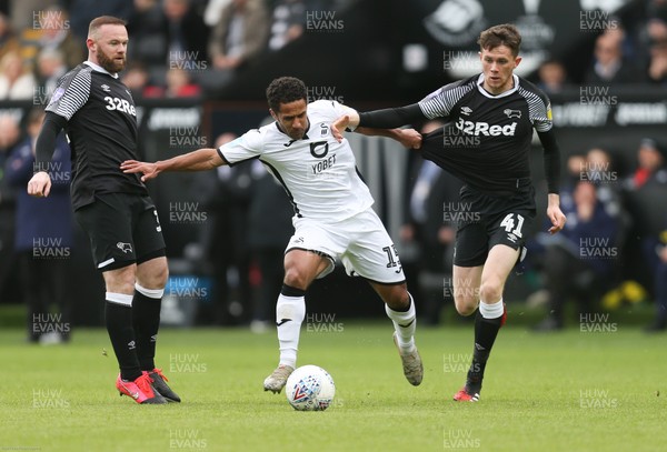 080220 - Swansea City v Derby County, Sky Bet Championship - Wayne Routledge of Swansea City and Max Bird of Derby County compete for the ball