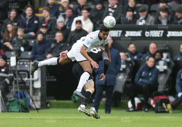 080220 - Swansea City v Derby County, Sky Bet Championship - Joel Asoro of Swansea City wins the ball from Jason Knight of Derby County
