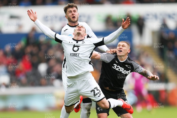 080220 - Swansea City v Derby County, Sky Bet Championship - Conor Gallagher of Swansea City is pushed by Martyn Waghorn of Derby County as he looks to win the ball