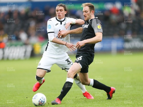 080220 - Swansea City v Derby County, Sky Bet Championship - Conor Gallagher of Swansea City and Matthew Clarke of Derby County compete for the ball
