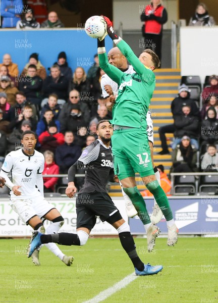 080220 - Swansea City v Derby County, Sky Bet Championship - Derby County goalkeeper Ben Hamer collects the ball as Andre Ayew of Swansea City challenges