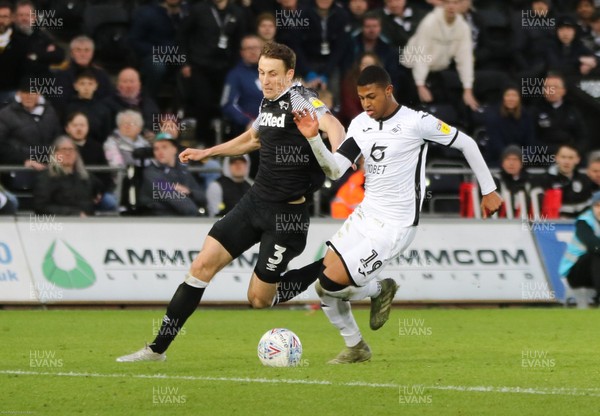080220 - Swansea City v Derby County, Sky Bet Championship - Rhian Brewster of Swansea City takes on Craig Forsyth of Derby County