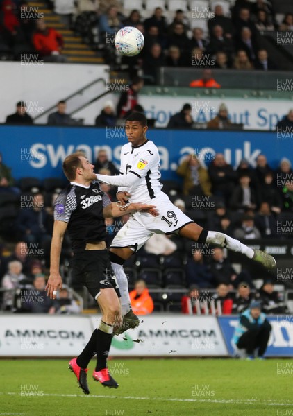 080220 - Swansea City v Derby County, Sky Bet Championship - Rhian Brewster of Swansea City and Matthew Clarke of Derby County compete for the ball