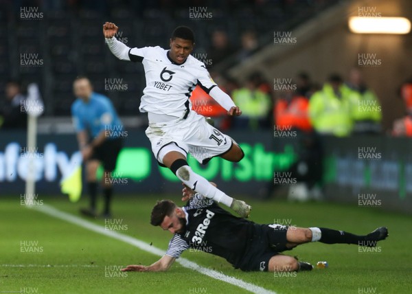 080220 - Swansea City v Derby County, Sky Bet Championship - Rhian Brewster of Swansea City is challenged by Graeme Shinnie of Derby County
