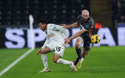 251125 - Swansea City v Derby County, EFL Sky Bet Championship - Ronald of Swansea City and Matt Clarke of Derby County compete for the ball