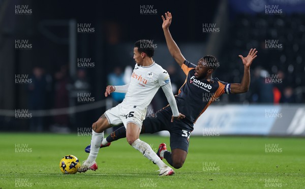 251125 - Swansea City v Derby County, EFL Sky Bet Championship - Ronald of Swansea City is challenged by Ebou Adams of Derby County