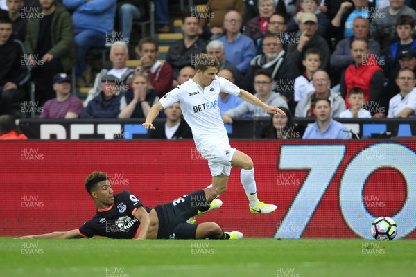 060517 - Swansea City v Everton, Premier League - Tom Carroll of Swansea City (right) in action with Mason Holgate of Everton