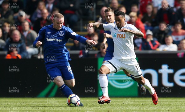 140418 - Swansea City v Everton - Premier League - Luciano Narsingh of Swansea gets past Wayne Rooney of Everton