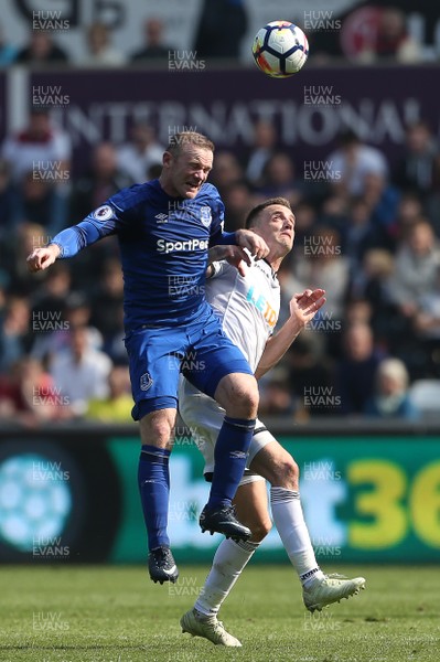 140418 - Swansea City v Everton - Premier League - Wayne Rooney of Everton is challenged by Andy King of Swansea