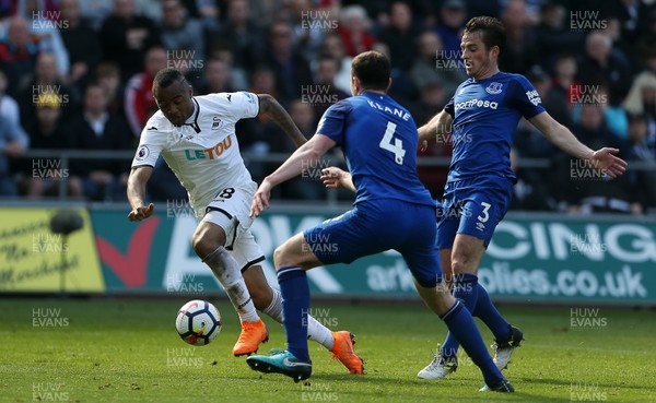 140418 - Swansea City v Everton - Premier League - Jordan Ayew of Swansea is challenged by Michael Keane of Everton