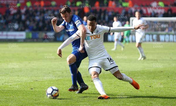 140418 - Swansea City v Everton - Premier League - Martin Olsson of Swansea is tackled by Seamus Coleman of Everton