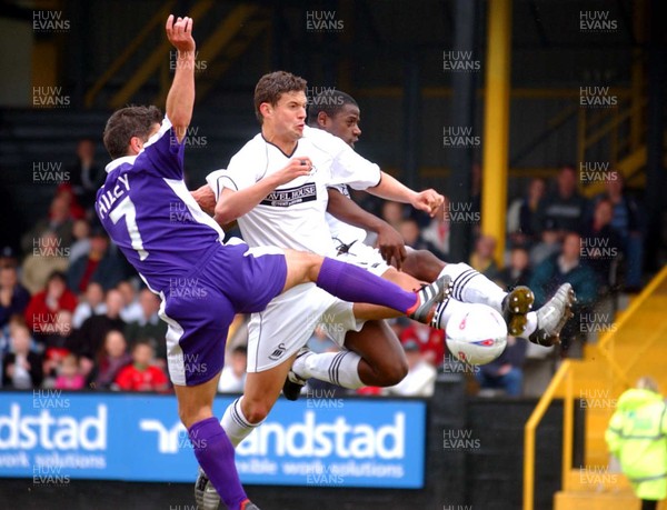 210403 - Swansea City v Exeter City - Third Division - Swansea's Marc Richards and Lenny Johnrose compete with Exeter's Scott Hiley