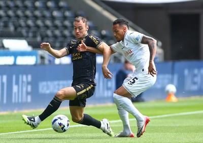 020825 - Swansea City v FC Lorient - Preseason Friendly - Ronald of Swansea City challenges Pablo Pagis of FC Lorient for the ball