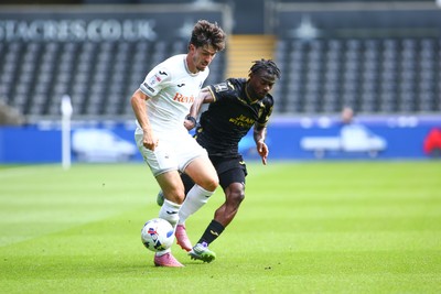 020825 - Swansea City v FC Lorient - Preseason Friendly - Josh Key of Swansea City takes on Darlin Yogwa of FC Lorient