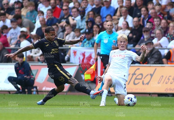 020825 - Swansea City v FC Lorient - Preseason Friendly - Melker Widell of Swansea City challenges Mohamad Bamba of FC Loreient for the ball