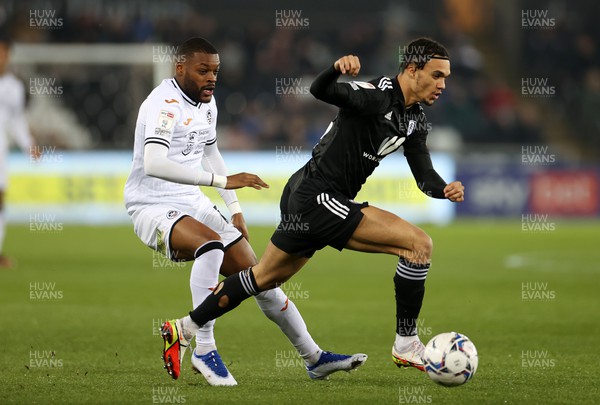 080322 - Swansea City v Fulham - SkyBet Championship - Antonee Robinson of Fulham is challenged by Olivier Ntcham of Swansea City