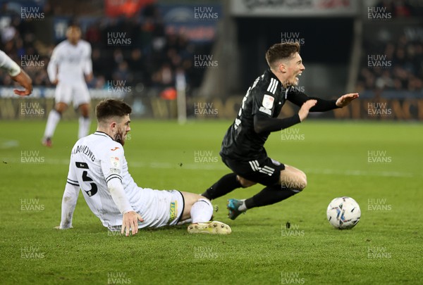 080322 - Swansea City v Fulham - SkyBet Championship - Ryan Manning of Swansea City is shown a straight red from referee Jarred Gillett for this tackle on Harry Wilson of Fulham