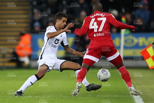 291119 - Swansea City v Fulham - SkyBet Championship - Aboubakar Kamara of Fulham is tackled by Kyle Naughton of Swansea City