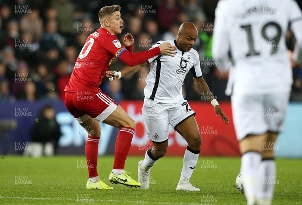 291119 - Swansea City v Fulham - SkyBet Championship - Andre Ayew of Swansea City is tackled by Tom Cairney of Fulham