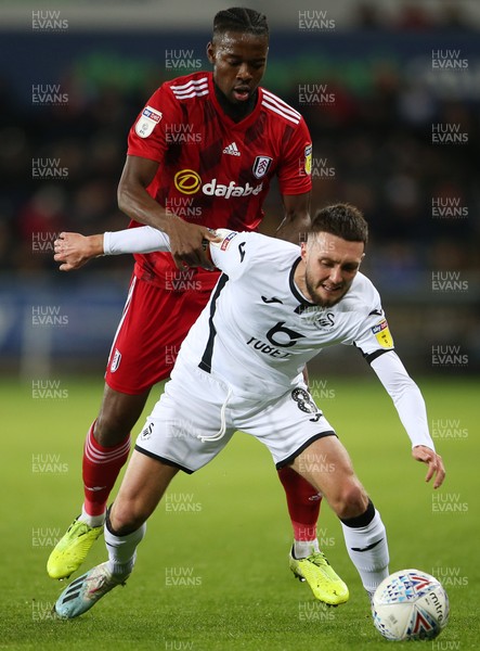 291119 - Swansea City v Fulham - SkyBet Championship - Matt Grimes of Swansea City is tackled by Joshua Onomah of Fulham