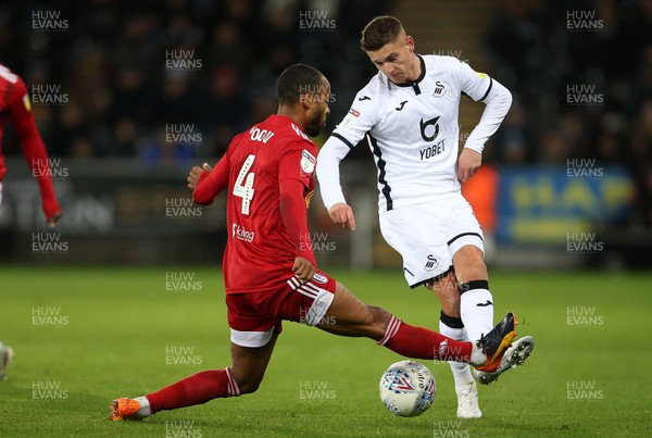 291119 - Swansea City v Fulham - SkyBet Championship - Kristoffer Peterson of Swansea City is tackled by Denis Odoi of Fulham