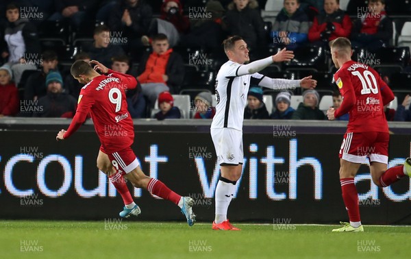291119 - Swansea City v Fulham - SkyBet Championship - Aleksandar Mitrovic of Fulham celebrates scoring a goal alongside a frustrated Connor Roberts of Swansea City