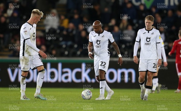 291119 - Swansea City v Fulham - SkyBet Championship - Dejected Sam Surridge, Andre Ayew and George Byers of Swansea City
