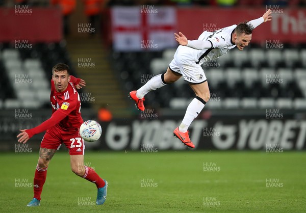 291119 - Swansea City v Fulham - SkyBet Championship - Connor Roberts of Swansea City is challenged by Joe Bryan of Fulham in the air