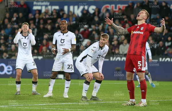 291119 - Swansea City v Fulham - SkyBet Championship - George Byers, Andre Ayew, Jay Fulton of Swansea City and Alfie Mawson of Fulham show a range of emotions during the game