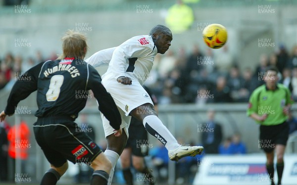 210106Swansea City v Hartlepool United Swansea's Adebayo Akinfenwa heads at goal  