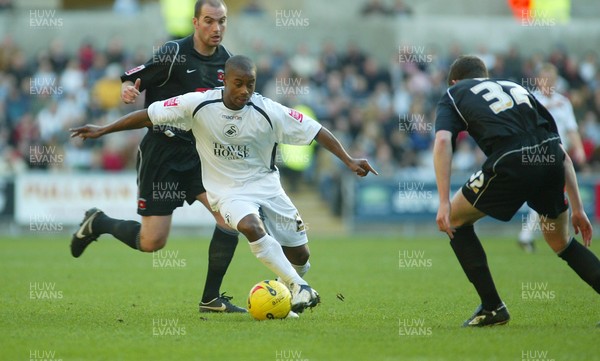 210106Swansea City v Hartlepool United Swansea's Leon Knight weaves his way past Gerard Nash  