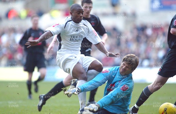 210106Swansea City v Hartlepool United Swansea's Leon Knight is brought down by Hartlepool keeper Dimitrios Konstantopoulos  