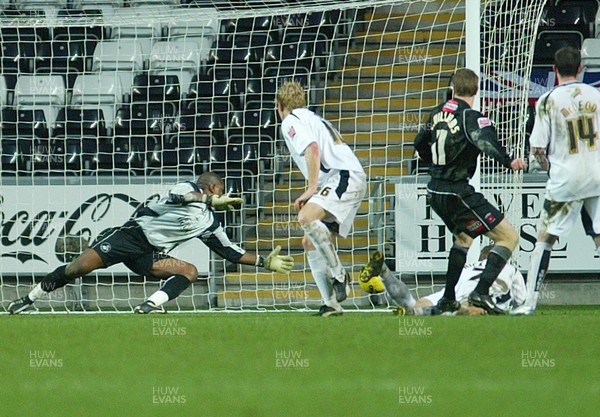 210106Swansea City v Hartlepool United Hartlepools Eifion Williams (11) puts the ball past Swansea keeper Willy Gueret to score in injury time and earn a draw  