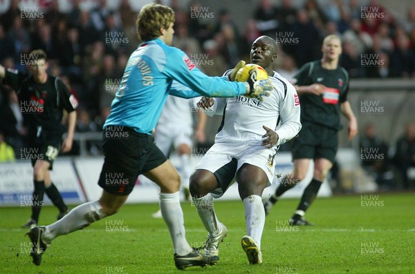 210106Swansea City v Hartlepool United Swansea's Adebayo Akinfenwa is denied by Hartlepool keeper Dimitrios Konstantopoulos  