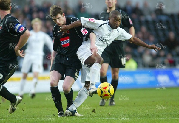 210106Swansea City v Hartlepool United Swansea's Leon Knight holds off Gerard Nash  