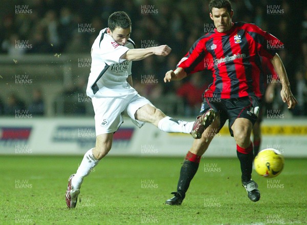 240206Swansea City v Huddersfield Swansea's Leon Britton strikes to score City's second goal 