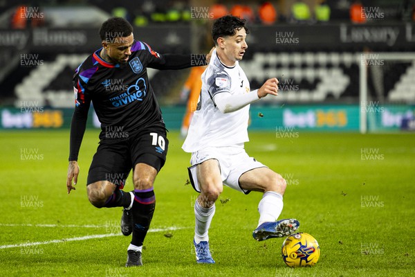 021223 - Swansea City v Huddersfield Town - Sky Bet Championship - Charlie Patino of Swansea City in action against Josh Koroma of Huddersfield Town